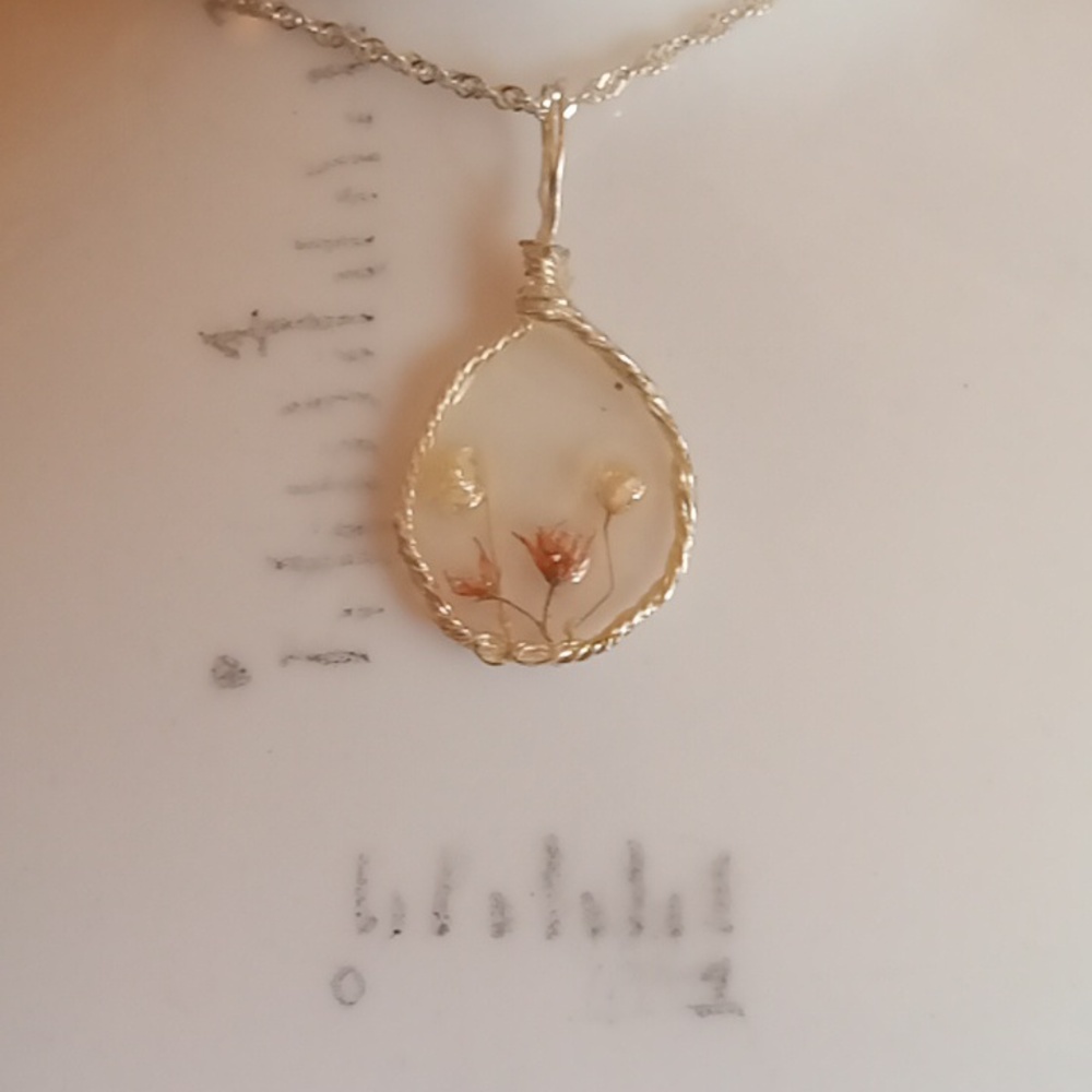 Floral necklace, amulet